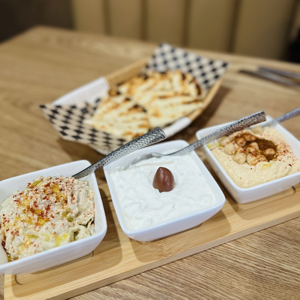 Combo appetizer: baba ganoush, tzatziki and hummus with toasted pita